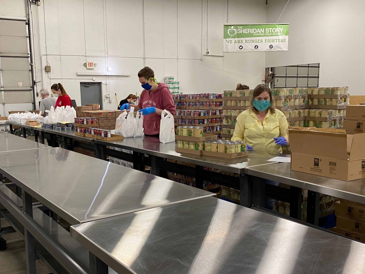 Volunteers packing food during COVID-19 pandemic