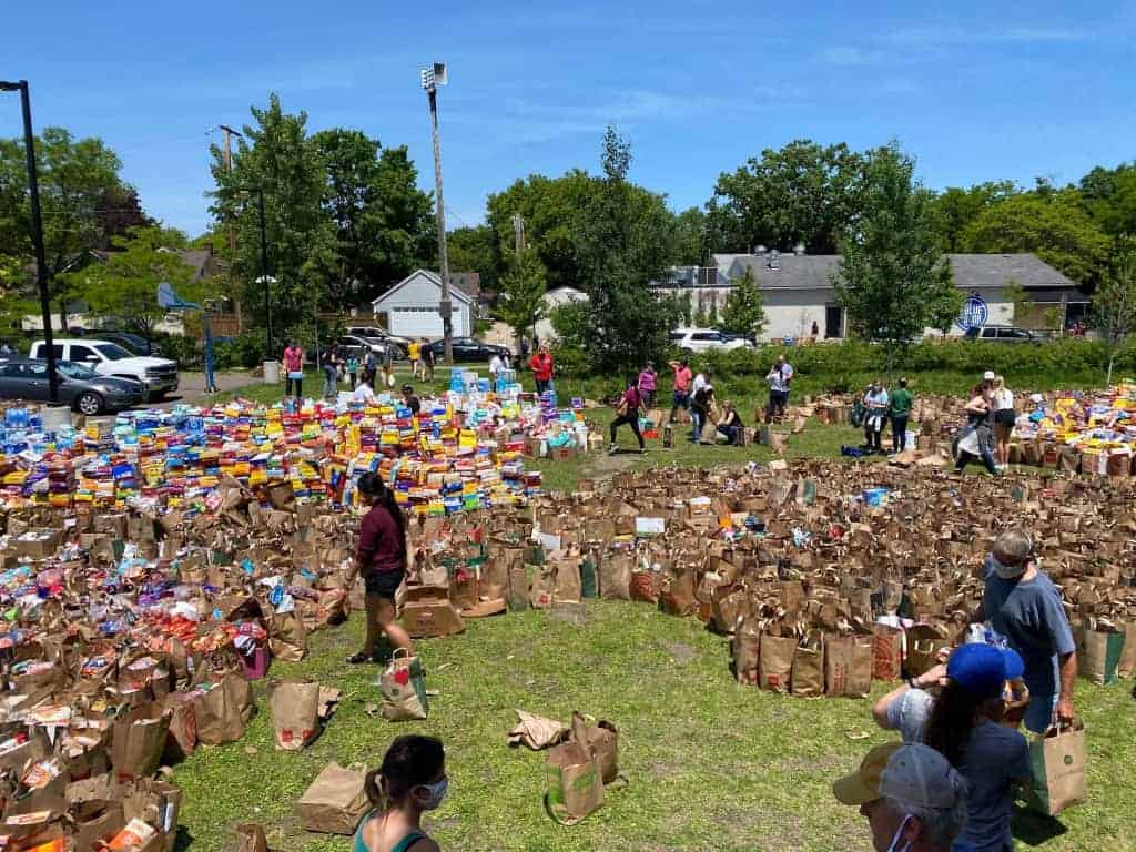 Volunteers and community members sorted through the donations, separating and grouping items into different categories.