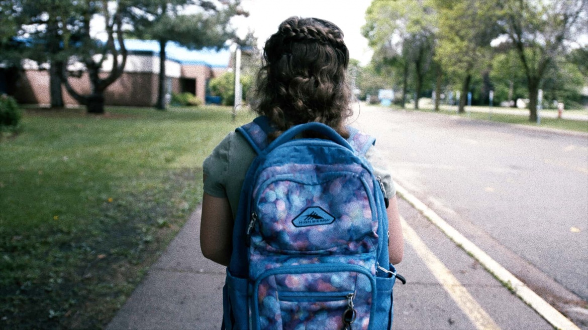 Every Meal Child Wearing Backpack