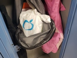 fodd bag containing 10 millionth meal placed in Richfield student's backpack